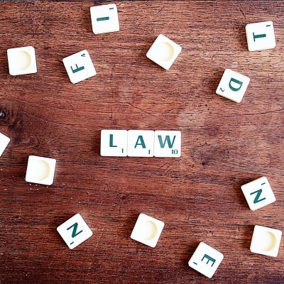 Letters LAW with scrabble pieces